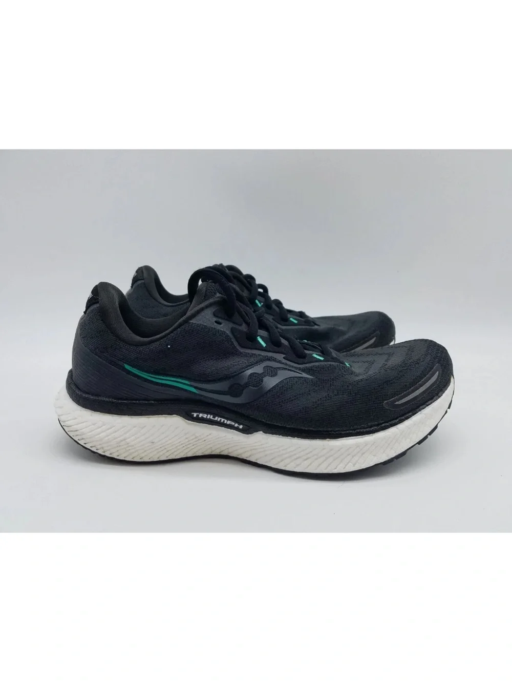 Saucony Black Running Shoes with Teal Accents